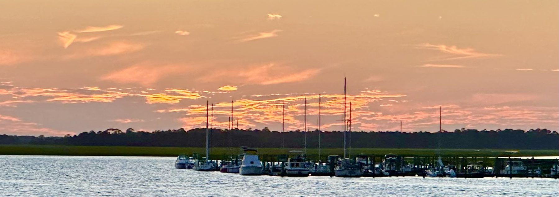 Marsh, creek and docks at dusk near Folly Beach, South Carolina.