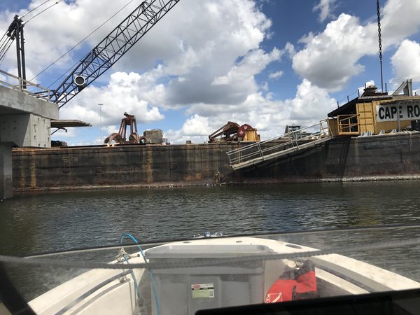 Dredge barge at Cape Romain: sediment moved by machine where tides move it by the ton.